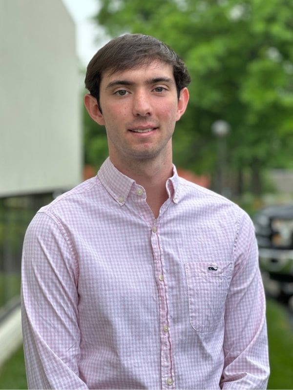 A photo of Matt Answini, A TP4 Advisor Summer Intern wearing a pink dress shirt.